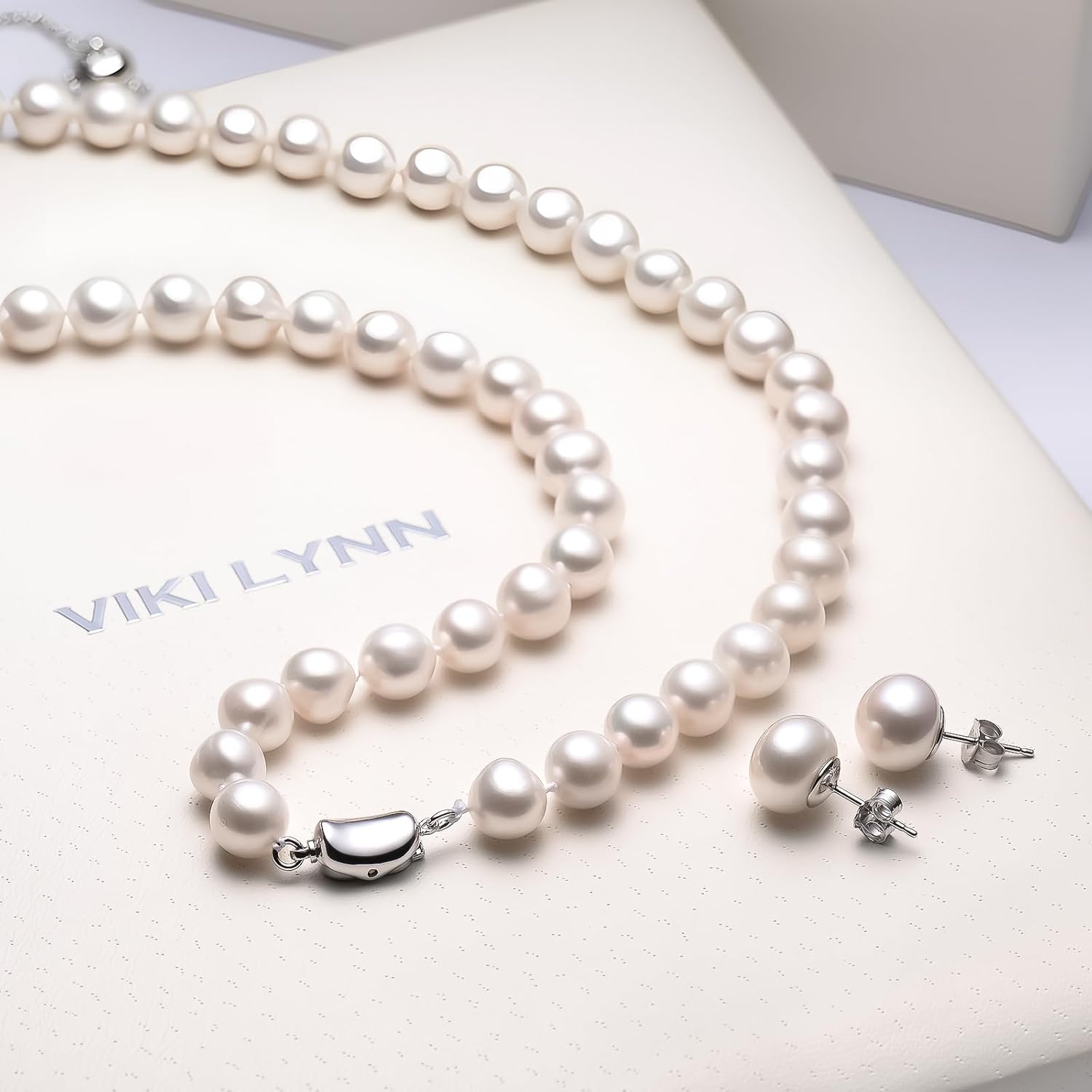 Sterling silver freshwater pearl necklace set with matching bracelet and stud earrings, classic style