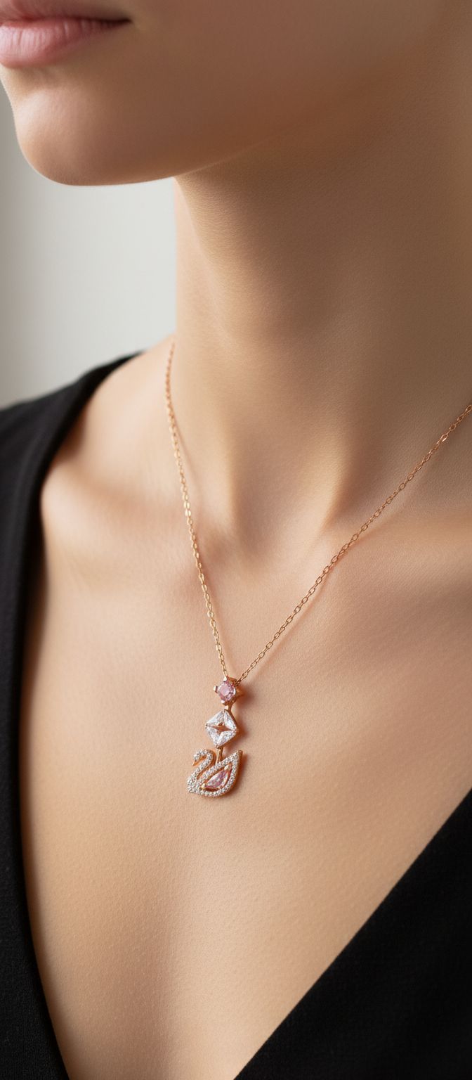 Modern brass swan jewelry set with blue, pink, and clear crystal stones