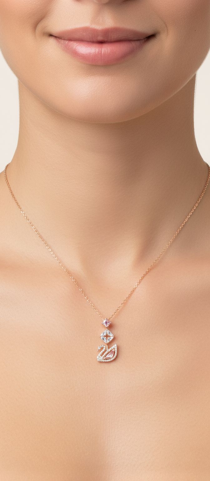 Modern brass swan jewelry set with blue, pink, and clear crystal stones