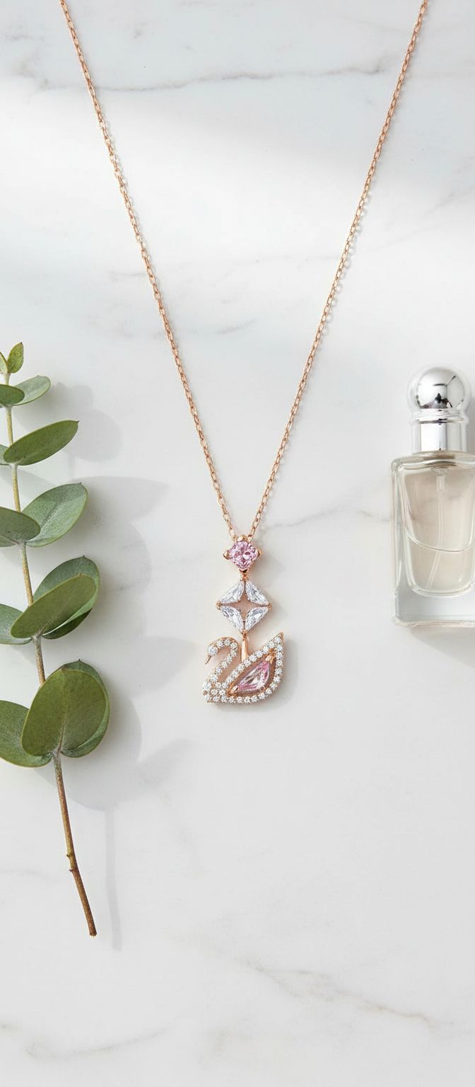 Modern brass swan jewelry set with blue, pink, and clear crystal stones