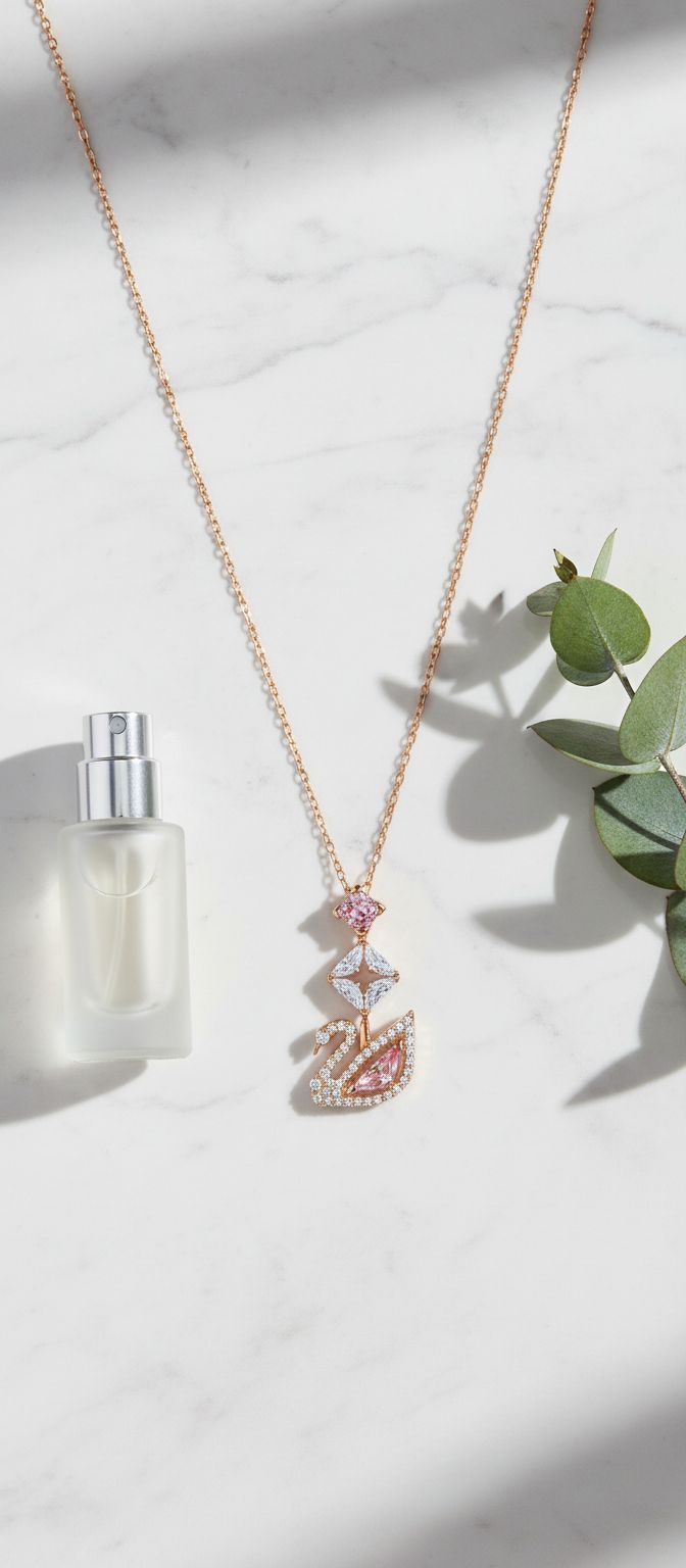 Modern brass swan jewelry set with blue, pink, and clear crystal stones