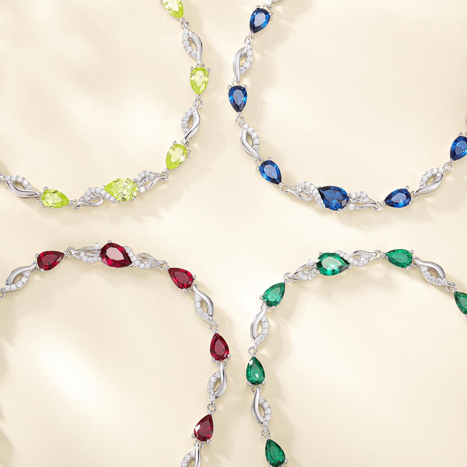 Sterling silver birthstone teardrop tennis bracelet with adjustable bolo chain, classic elegant design
