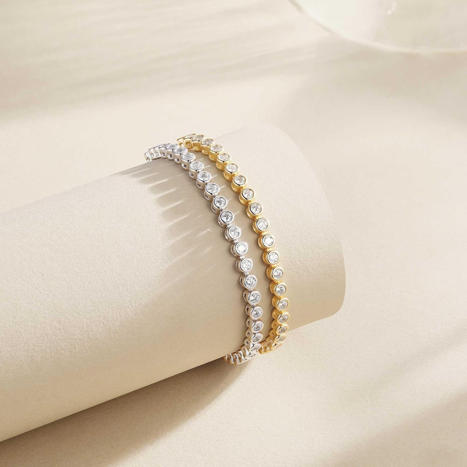 Adjustable sterling silver tennis bracelet with cubic zirconia stones and 14K gold plating, classic fine jewelry style