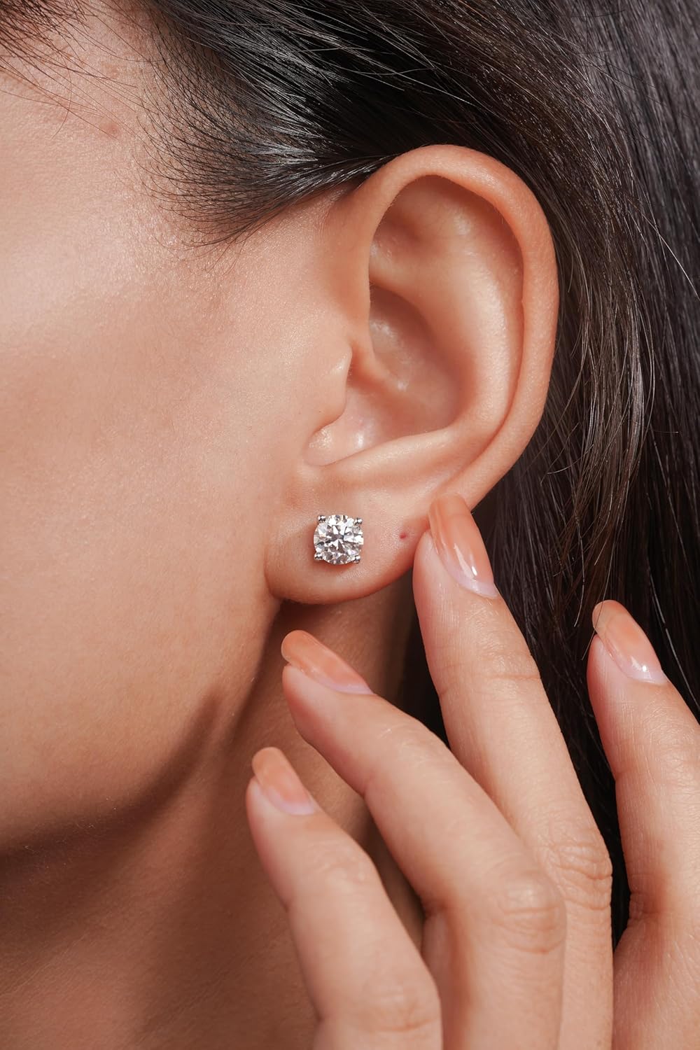 Sterling silver moissanite stud earrings with round brilliant cut stones, classic minimalist style