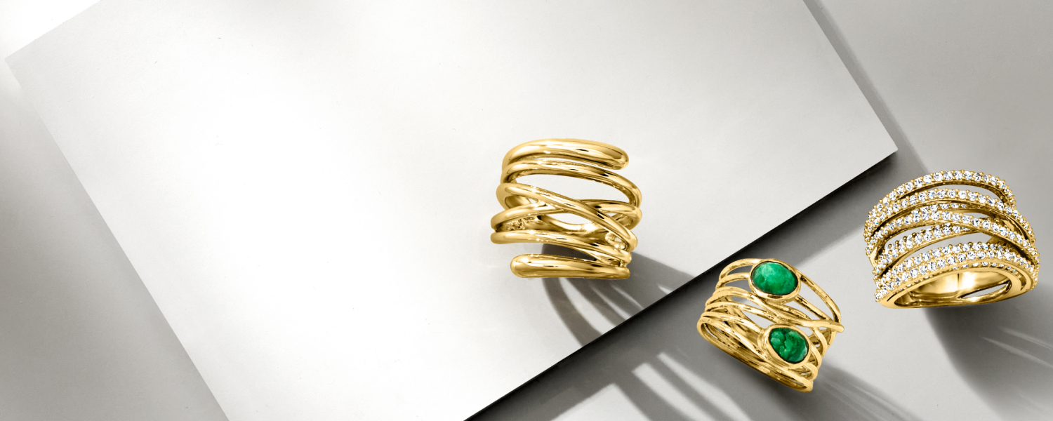 Round and baguette diamond multi-row statement ring in 14kt yellow gold