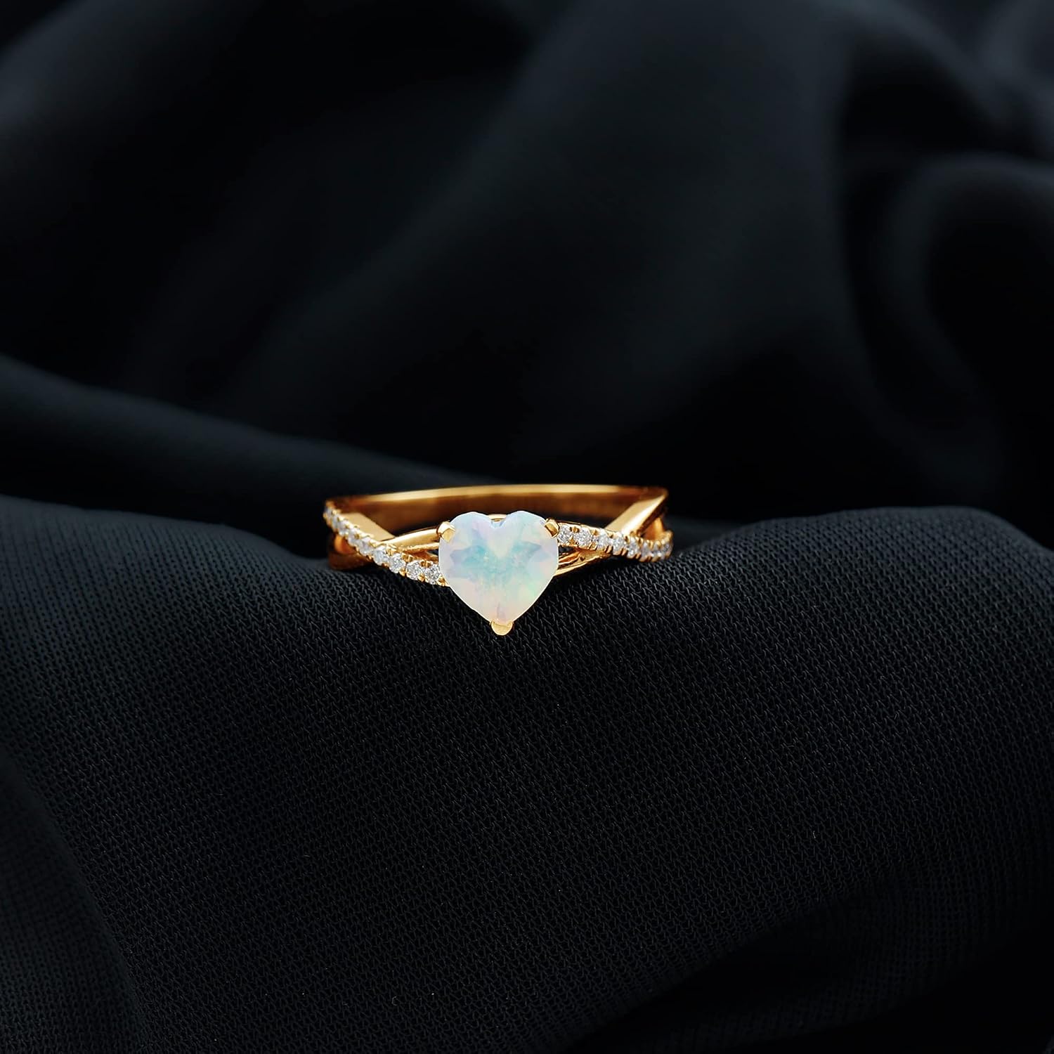 Sterling silver engagement ring featuring a heart-shaped Ethiopian opal stone with diamond accents, modern fine jewelry design