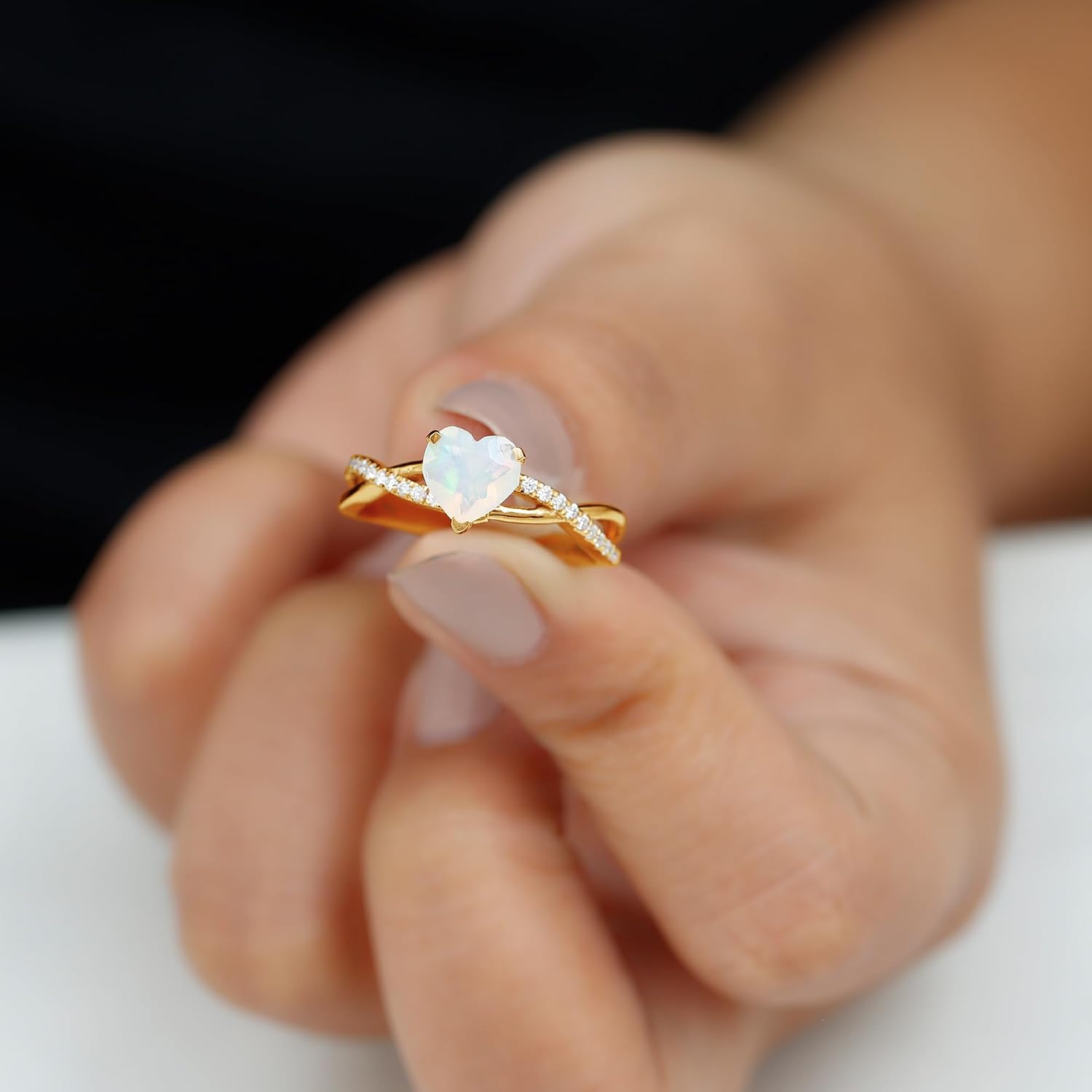 Sterling silver engagement ring featuring a heart-shaped Ethiopian opal stone with diamond accents, modern fine jewelry design