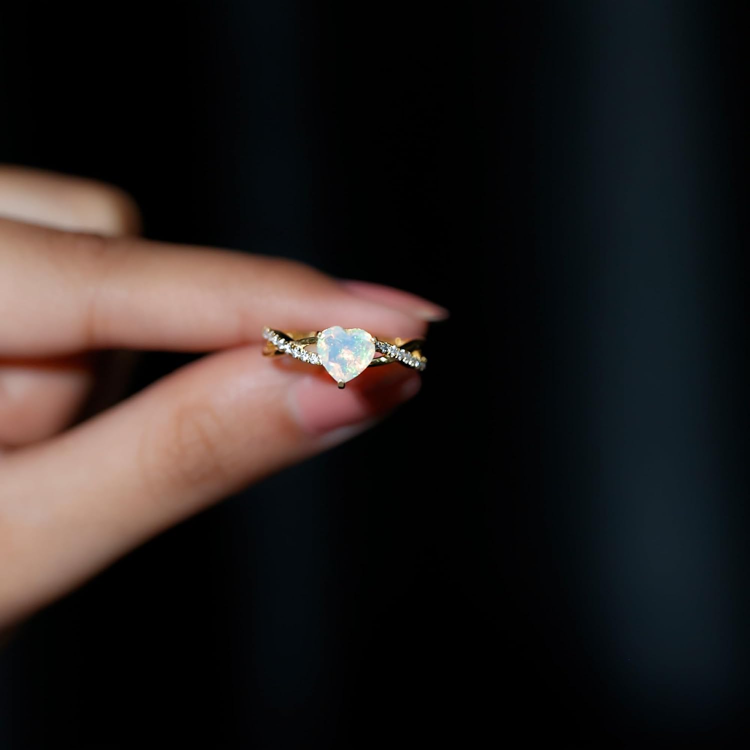 Sterling silver engagement ring featuring a heart-shaped Ethiopian opal stone with diamond accents, modern fine jewelry design