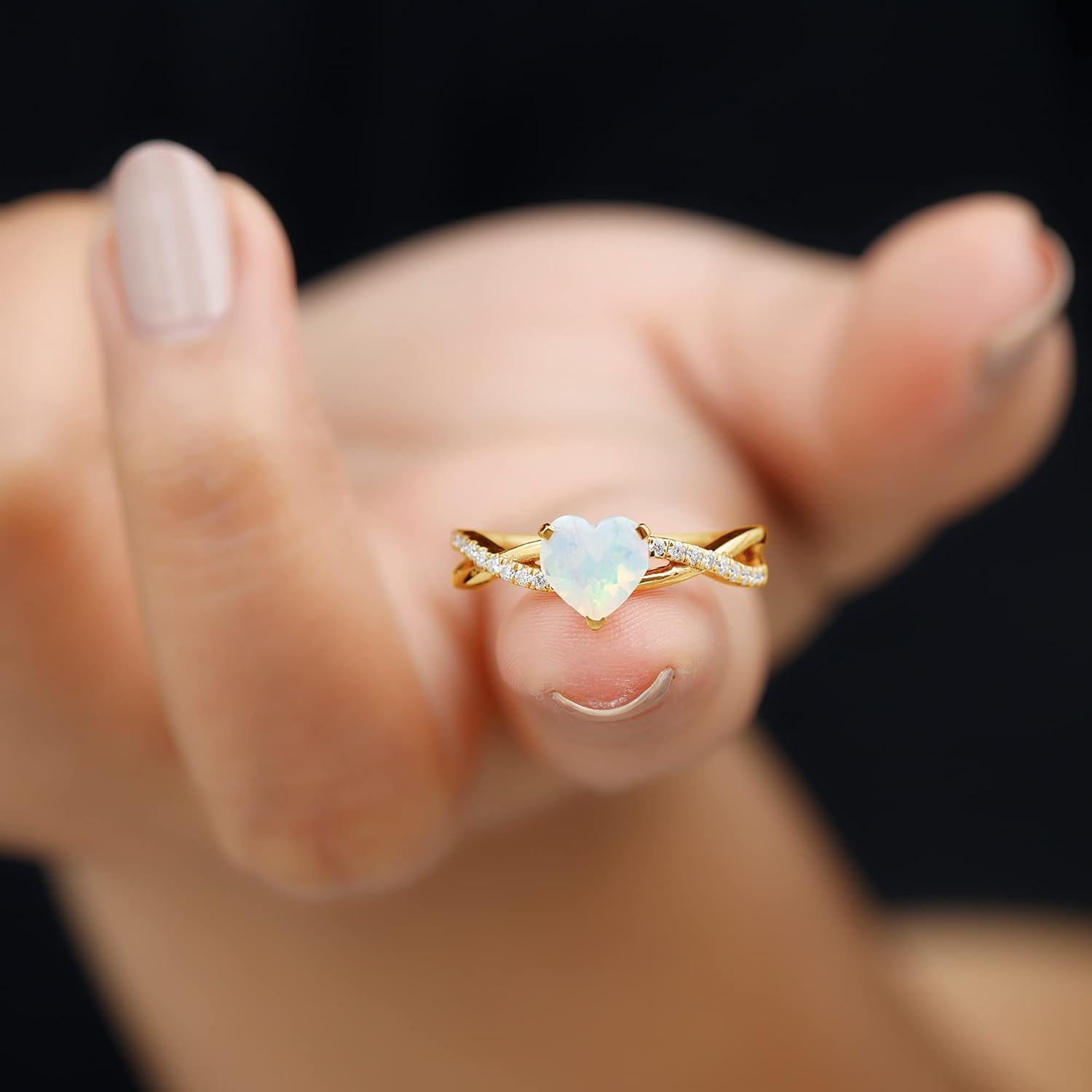 Sterling silver engagement ring featuring a heart-shaped Ethiopian opal stone with diamond accents, modern fine jewelry design