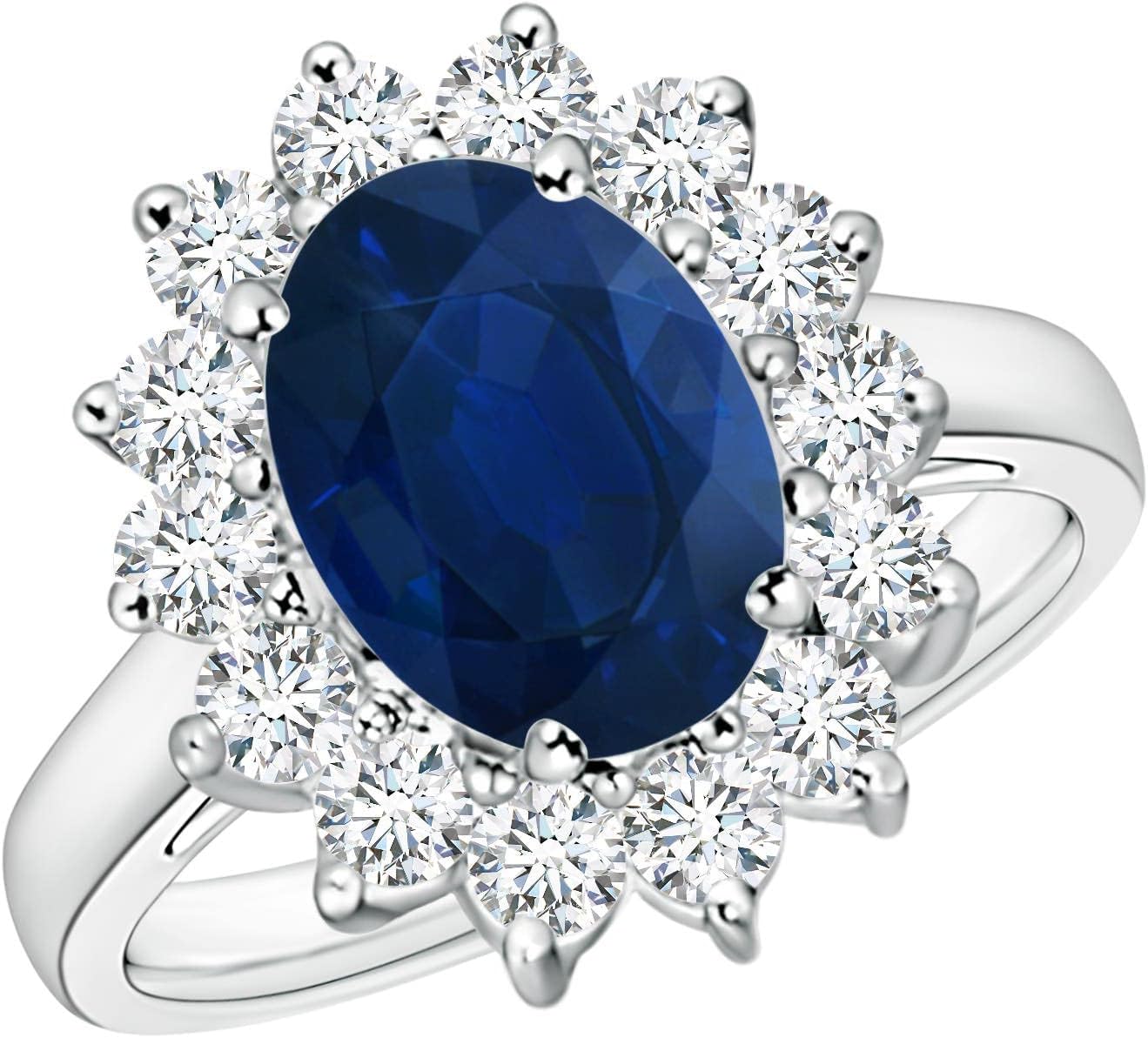 Blue sapphire halo ring in 14K gold and platinum with romantic princess Diana inspired design