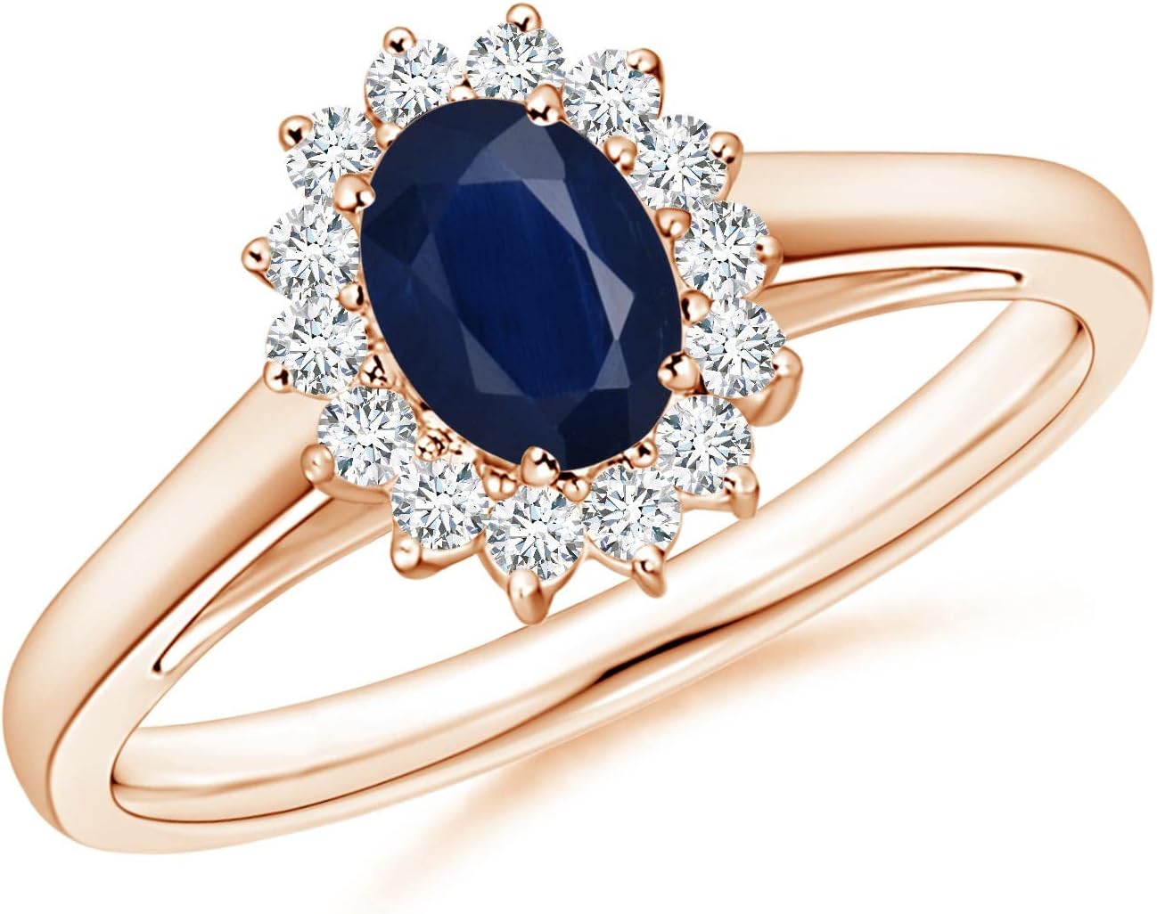 Blue sapphire halo ring in 14K gold and platinum with romantic princess Diana inspired design