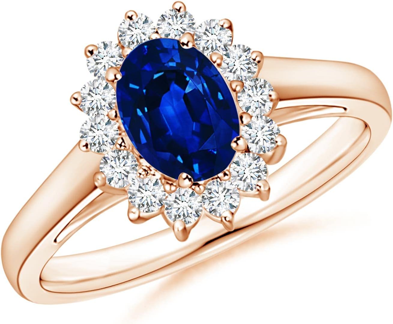 Blue sapphire halo ring in 14K gold and platinum with romantic princess Diana inspired design