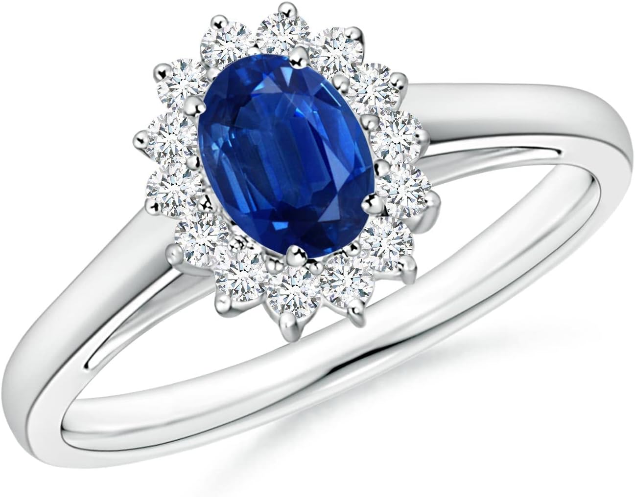 Blue sapphire halo ring in 14K gold and platinum with romantic princess Diana inspired design