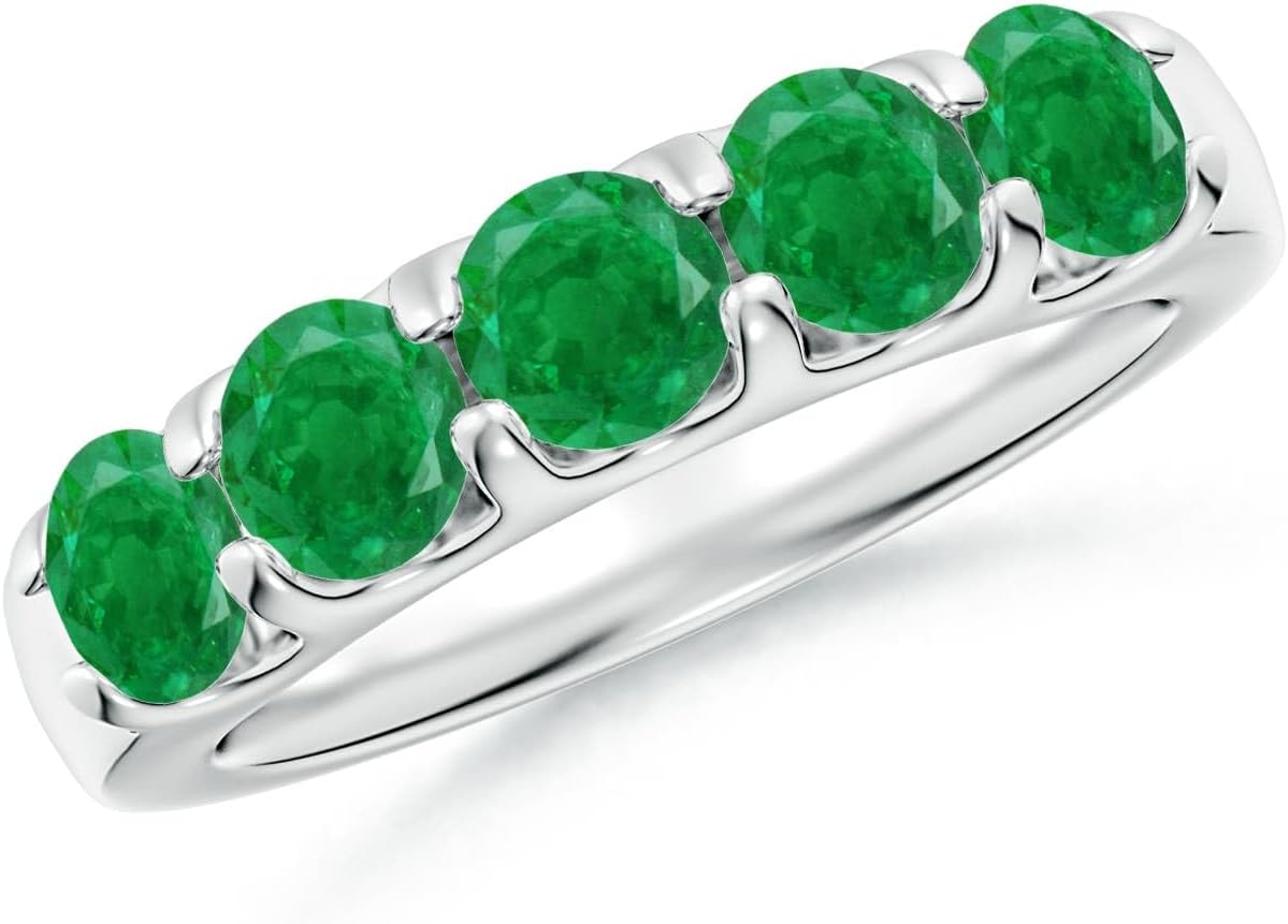 Emerald half eternity wedding band in 14K gold with shared prong setting, romantic gemstone design