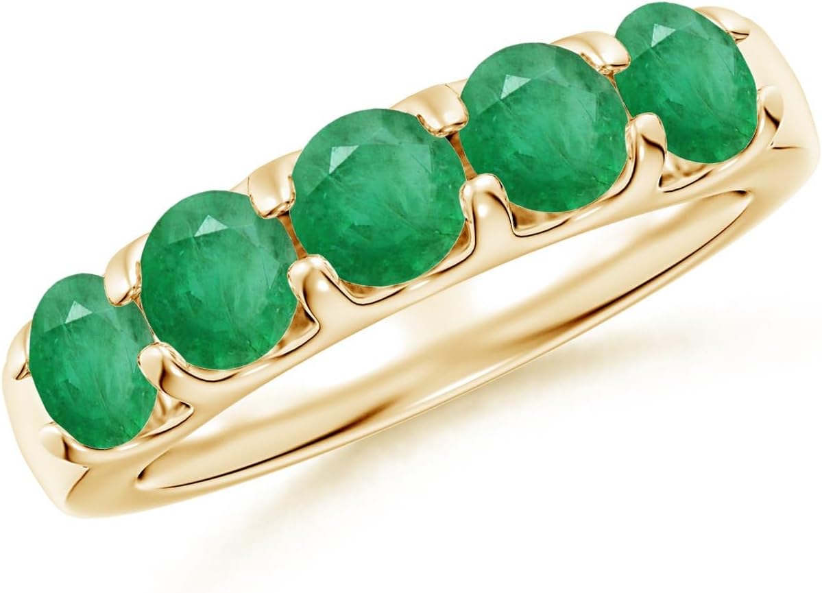 Emerald half eternity wedding band in 14K gold with shared prong setting, romantic gemstone design