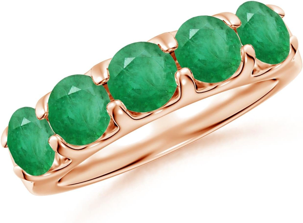 Emerald half eternity wedding band in 14K gold with shared prong setting, romantic gemstone design
