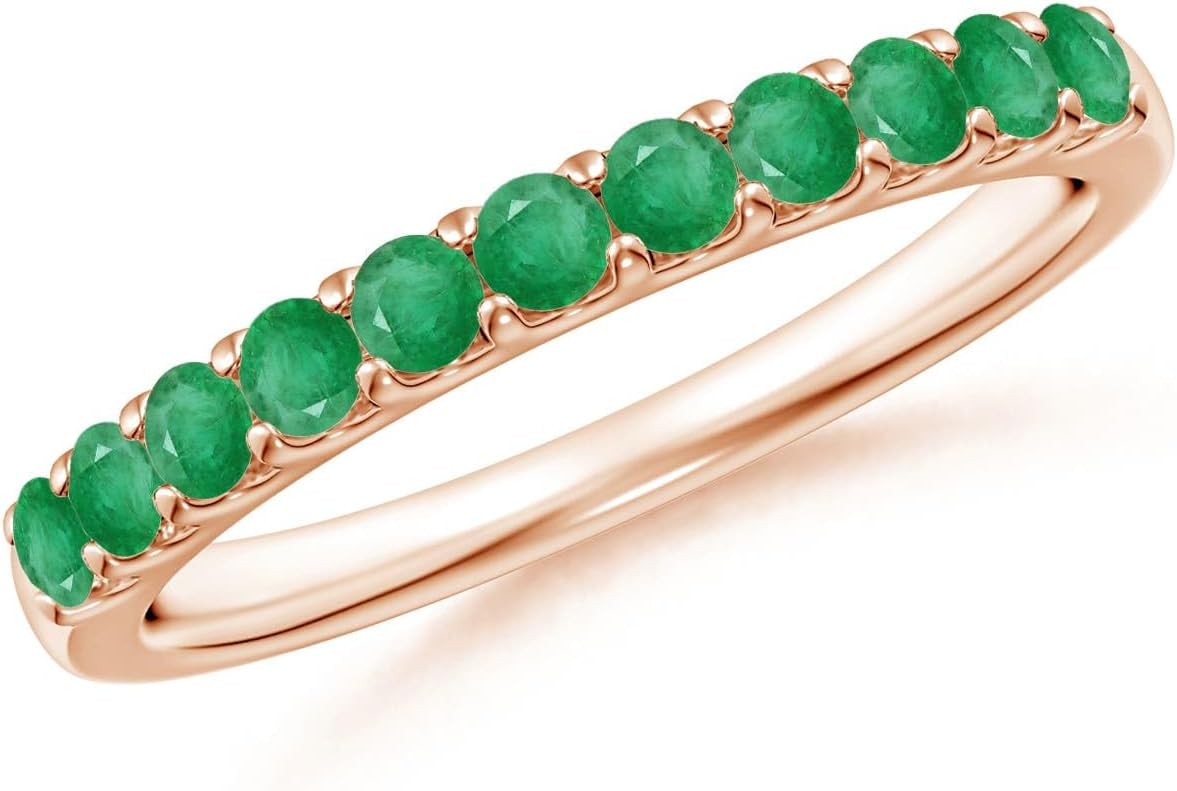 Emerald half eternity wedding band in 14K gold with shared prong setting, romantic gemstone design