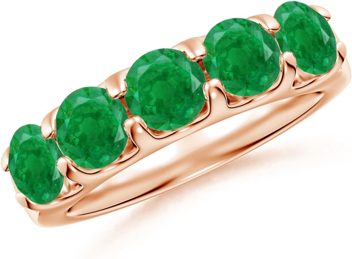 Emerald half eternity wedding band in 14K gold with shared prong setting, romantic gemstone design
