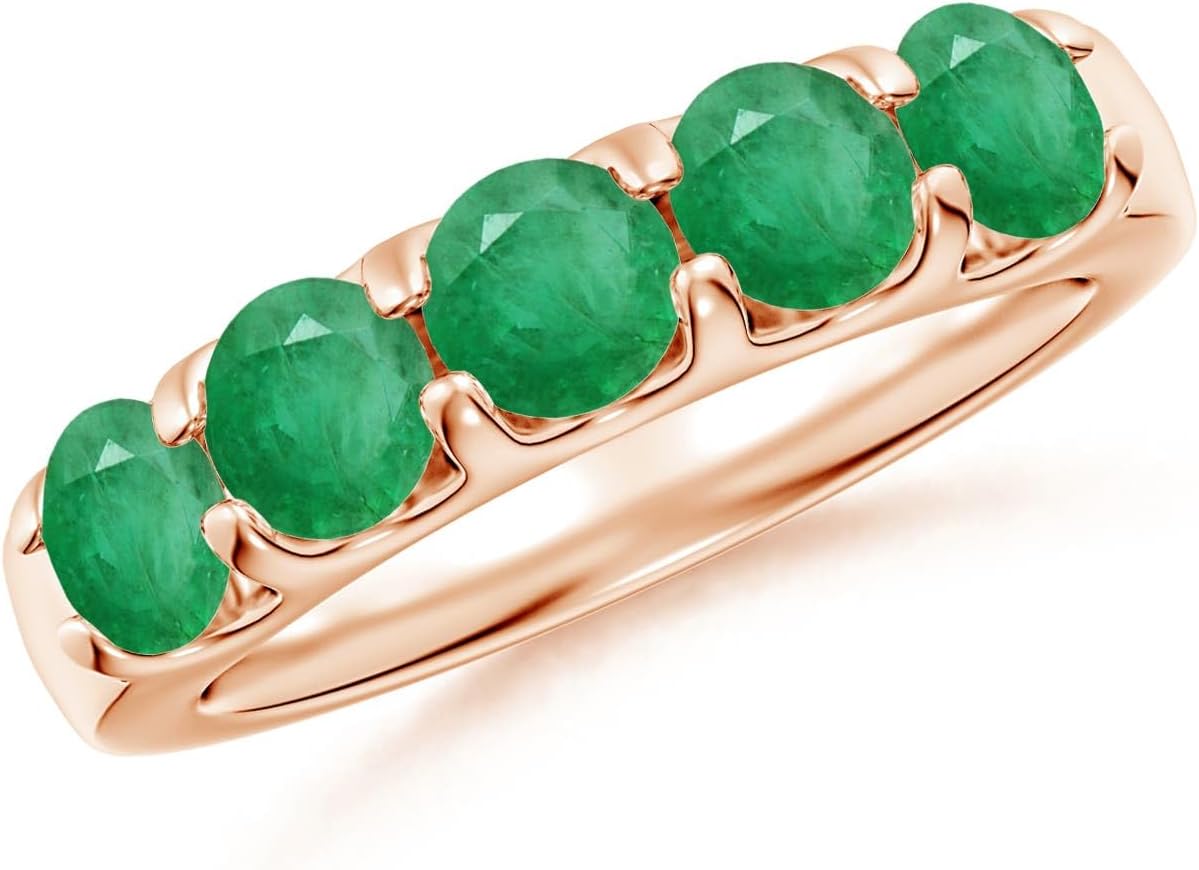 Emerald half eternity wedding band in 14K gold with shared prong setting, romantic gemstone design