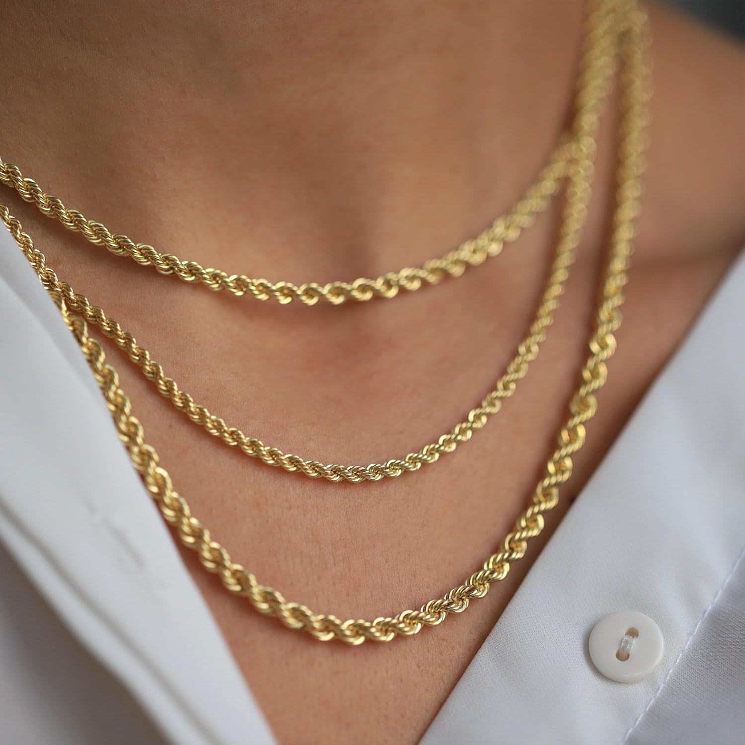 Solid 10K yellow gold rope chain necklace with diamond cut texture and lobster claw clasp, available in multiple widths