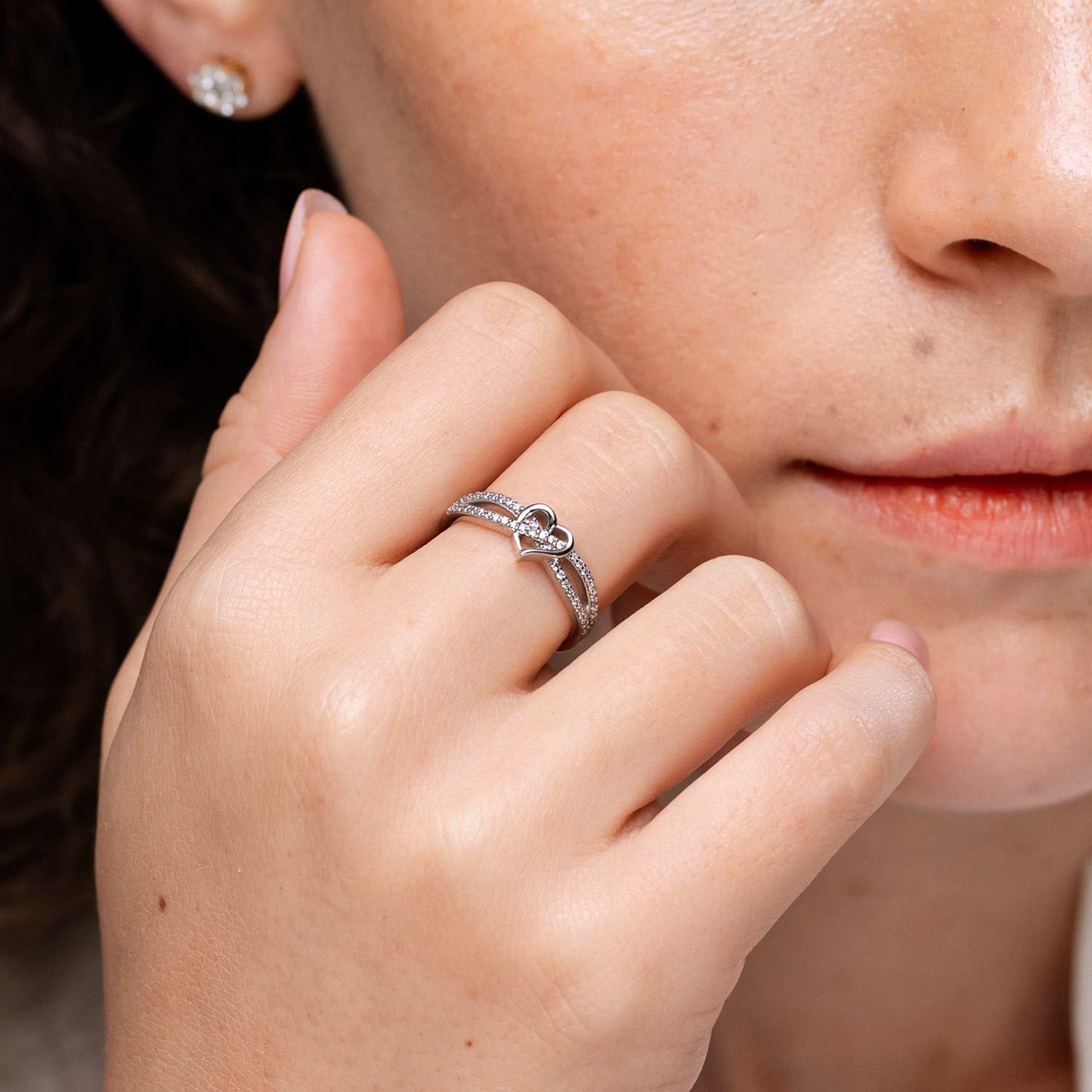 Sterling silver promise ring with round diamond criss cross heart design, romantic infinity style