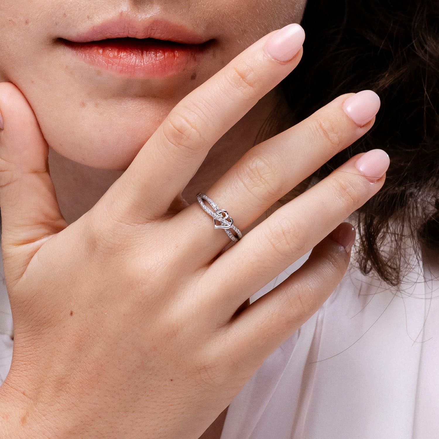 Sterling silver promise ring with round diamond criss cross heart design, romantic infinity style