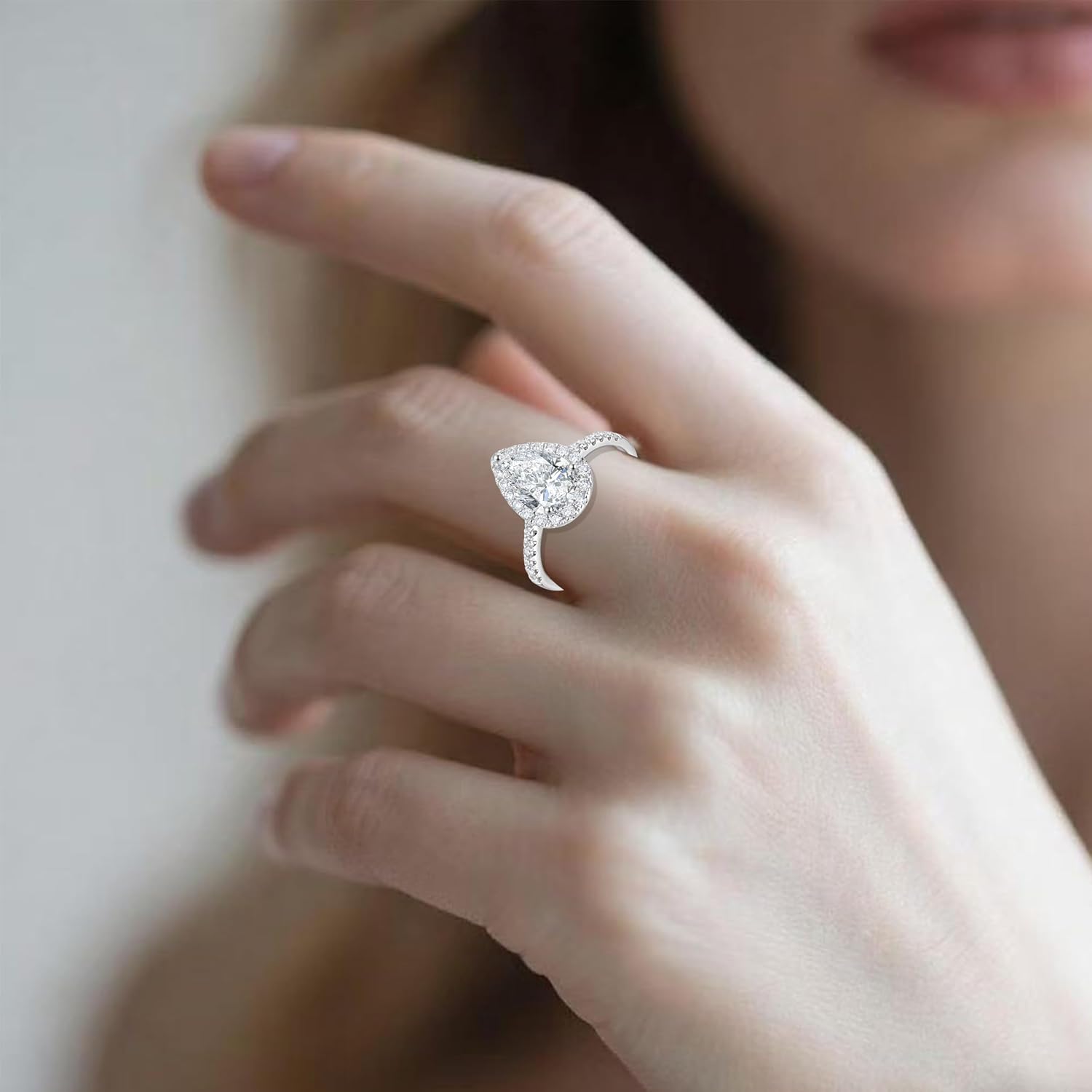 14k white gold halo engagement ring with lab-grown diamond center stone and side stone accents, classic bridal jewelry