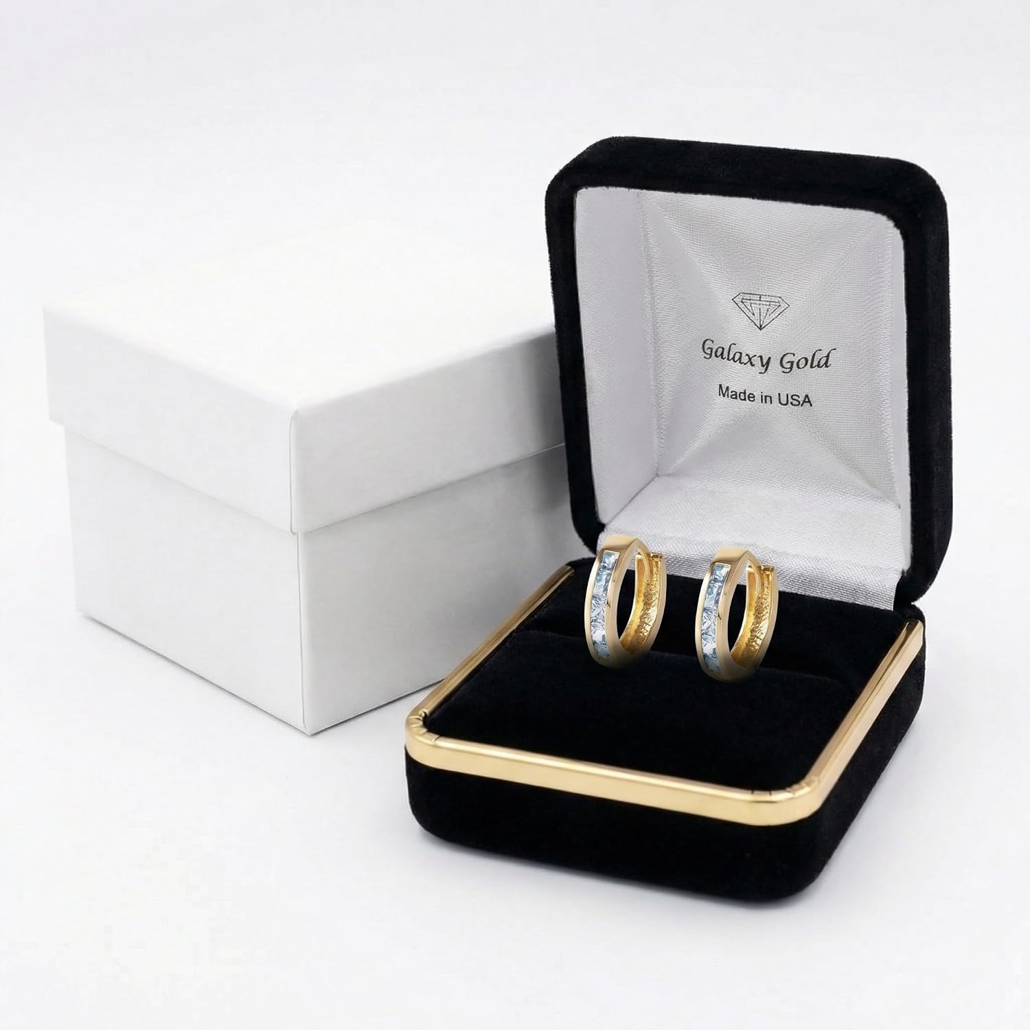 14K yellow gold aquamarine huggie hoop earrings with March birthstone gemstones, classic fine jewelry style